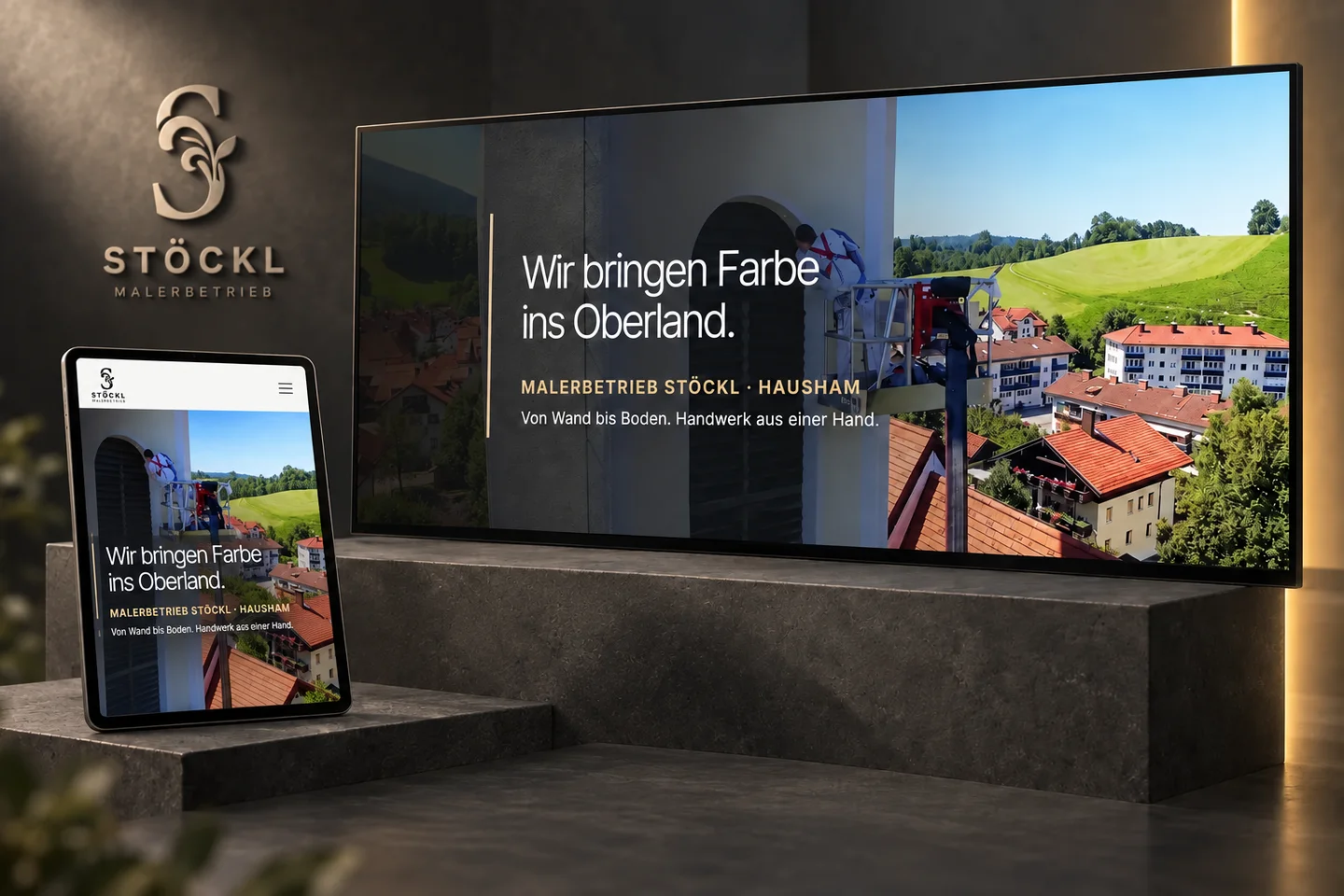 Stöckl project presentation: the creative on a large screen and tablet within a dark spatial setting